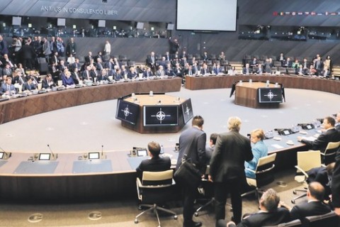 Heads of state and government with their delegations attend a working session during the summit at NATO headquarters, Brussels, July 11.