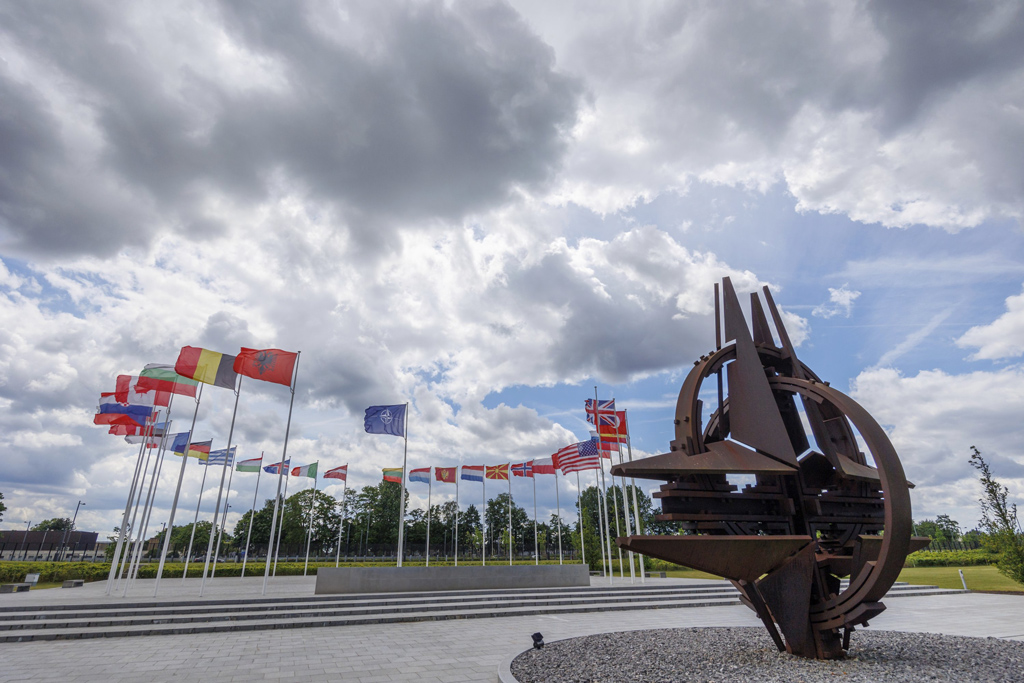Who overshadows NATO’s Madrid summit?